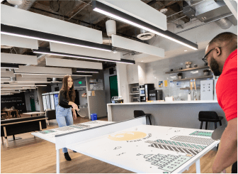 Employees playing ping pong in Upgrade's Phoenix office