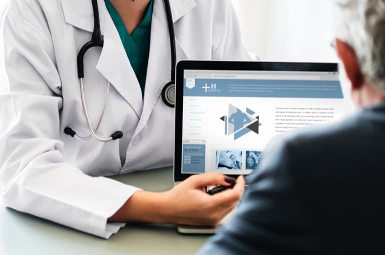 Image of doctor talking with patient